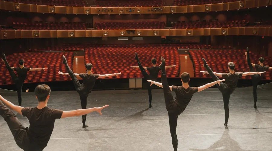Young dancers training at the barre